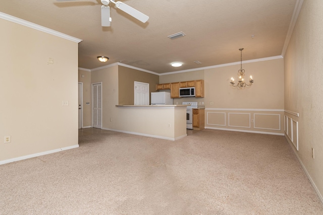 unfurnished living room with crown molding and ceiling fan with notable chandelier