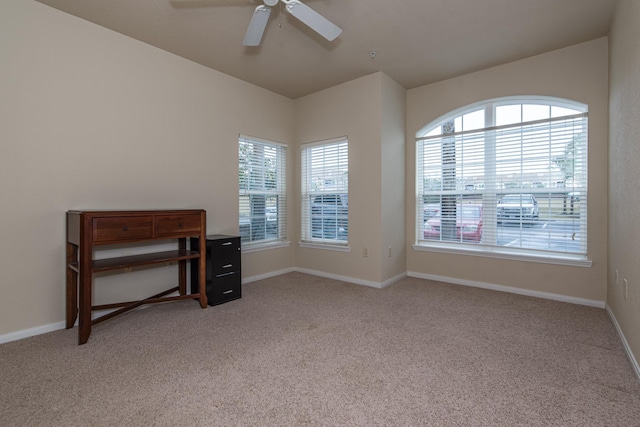 empty room with light carpet and ceiling fan