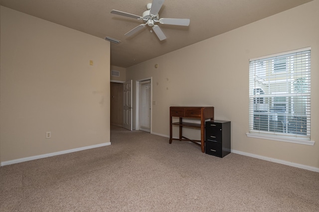 unfurnished bedroom with carpet, ceiling fan, and a closet