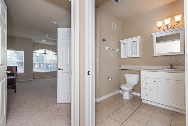 bathroom with vanity, ceiling fan, tile patterned floors, and toilet