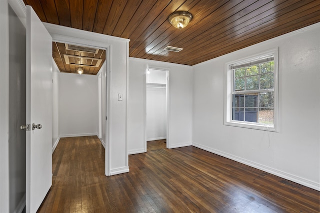 unfurnished bedroom with dark hardwood / wood-style floors, wood ceiling, and a closet