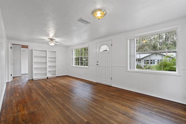 foyer with dark hardwood / wood-style flooring and ceiling fan