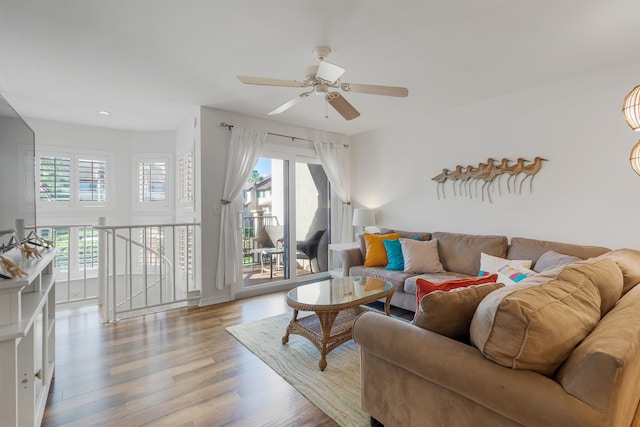 living room featuring ceiling fan and wood finished floors