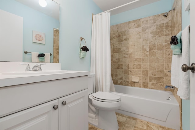 full bath with vanity, shower / bath combo with shower curtain, and toilet