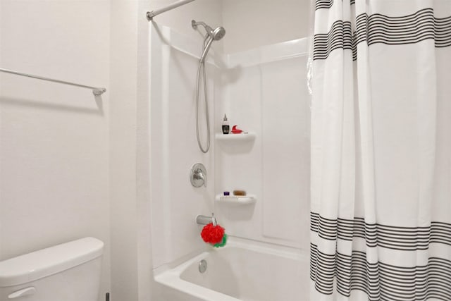 bathroom with toilet and shower / tub combo with curtain