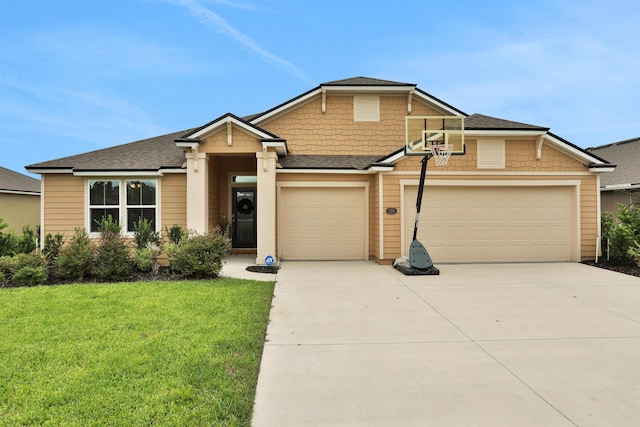 view of front of property featuring a front yard and a garage