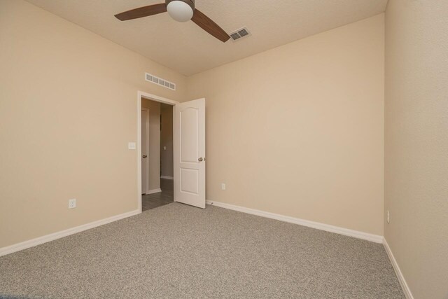 101 Sailors Landing Ct, Saint Augustine, FL 32084 - carpeted empty room with baseboards, visible vents, and a ceiling fan