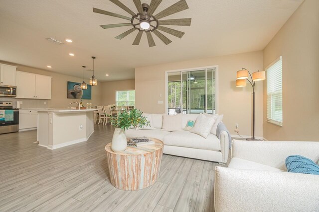 101 Sailors Landing Ct, Saint Augustine, FL 32084 - living room featuring recessed lighting, light wood-style floors, ceiling fan, and visible vents