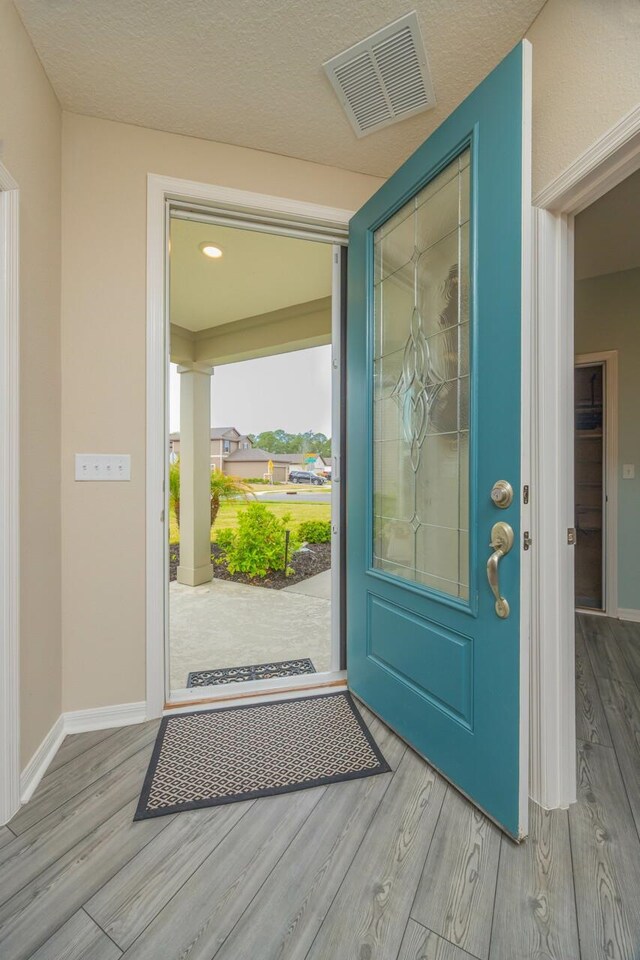 101 Sailors Landing Ct, Saint Augustine, FL 32084 - foyer entrance featuring baseboards, visible vents, and wood finished floors