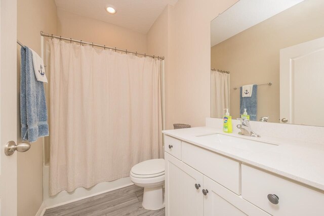 101 Sailors Landing Ct, Saint Augustine, FL 32084 - bathroom featuring toilet, vanity, shower / bath combo, and wood finished floors