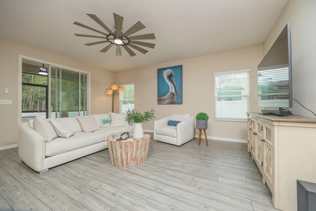 101 Sailors Landing Ct, Saint Augustine, FL 32084 - living room with baseboards, light wood-type flooring, and a ceiling fan