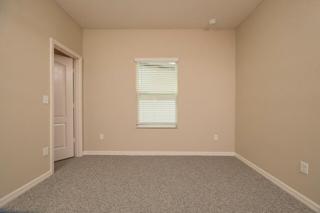 101 Sailors Landing Ct, Saint Augustine, FL 32084 - spare room featuring baseboards and carpet floors