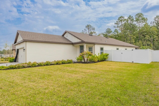 101 Sailors Landing Ct, Saint Augustine, FL 32084 - view of front of property featuring fence, an attached garage, concrete driveway, a front yard, and board and batten siding