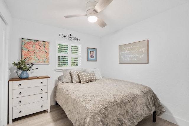 bedroom featuring light wood-type flooring and ceiling fan