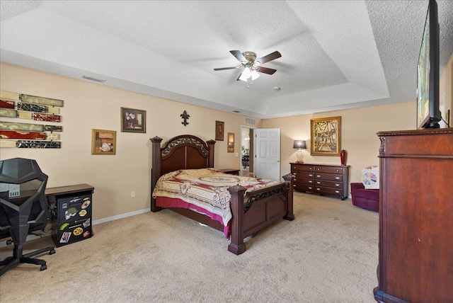 14 Serbian Bellflower Trl, Palm Coast, FL 32164 - bedroom with a textured ceiling, visible vents, carpet flooring, and a raised ceiling