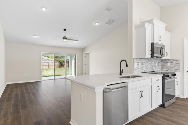 kitchen with a ceiling fan, visible vents, a sink, appliances with stainless steel finishes, and open floor plan