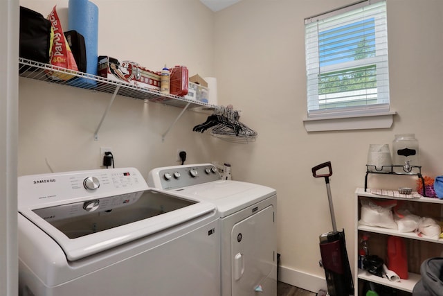 1312 Eisenhower Dr, Saint Augustine, FL 32084 - laundry area featuring separate washer and dryer and wood finished floors