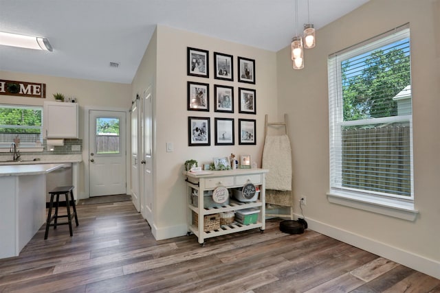 1312 Eisenhower Dr, Saint Augustine, FL 32084 - foyer with healthy amount of natural light and wood finished floors