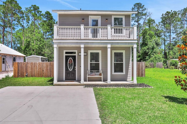 1312 Eisenhower Dr, Saint Augustine, FL 32084 - view of front of property with covered porch and a balcony