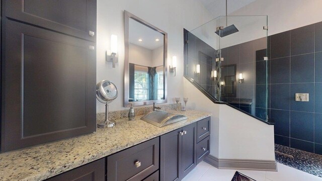 dining area with a textured ceiling, tile patterned floors, and crown molding