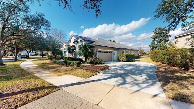 view of front of property with a garage and a front yard