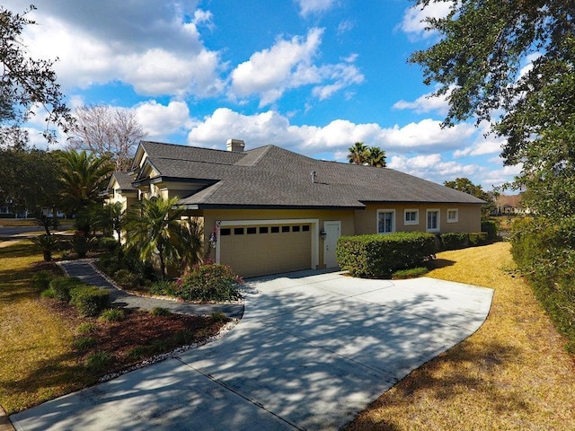 view of front of home featuring a garage and a front yard