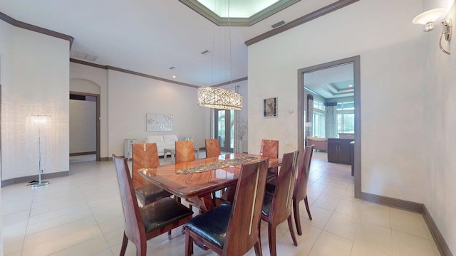 tiled dining room with crown molding