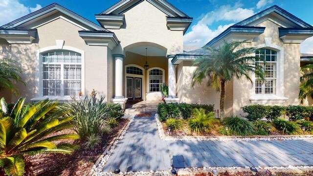 view of swimming pool with a patio area and a lanai