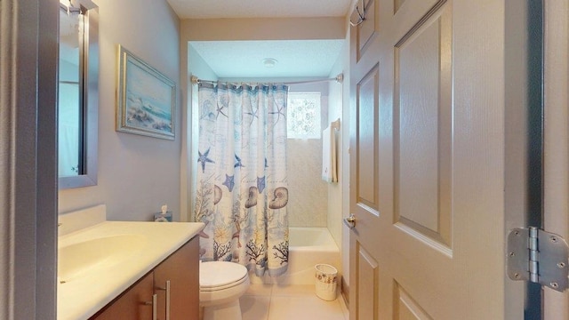 full bathroom featuring tile patterned floors, vanity, toilet, and shower / bath combo