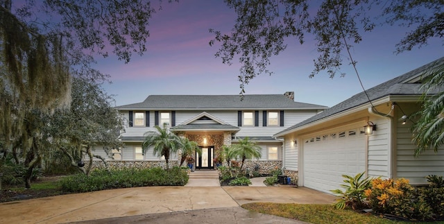 view of front of property with a garage