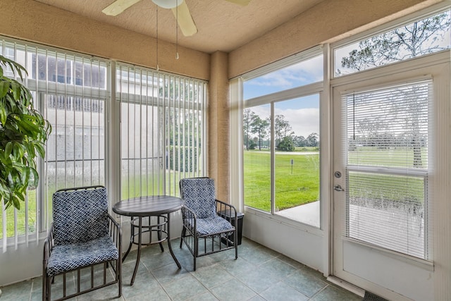 sunroom / solarium with ceiling fan