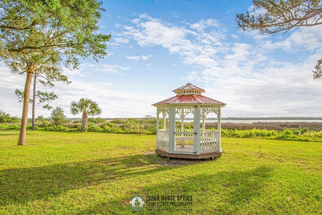 view of property's community featuring a gazebo and a lawn