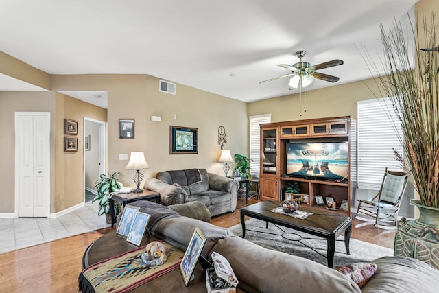 living room with ceiling fan and light hardwood / wood-style floors