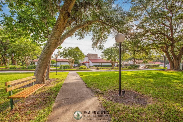 view of home's community featuring a lawn