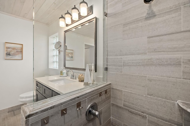 bathroom with vanity, toilet, crown molding, and wooden ceiling