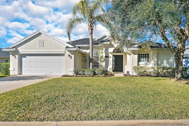 ranch-style home featuring a garage and a front lawn