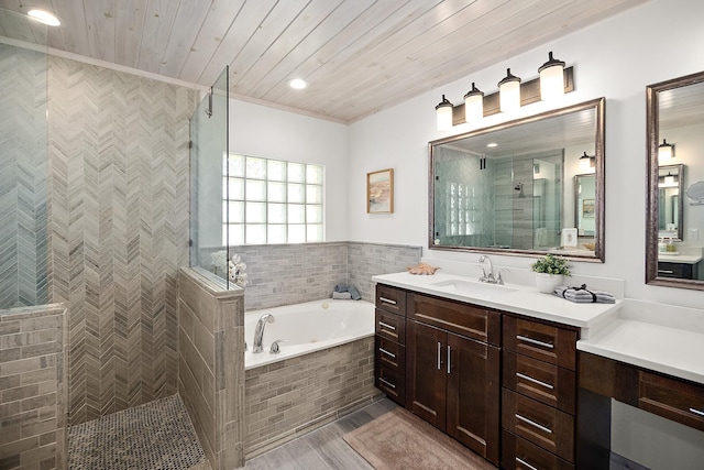 bathroom featuring wooden ceiling, vanity, and plus walk in shower