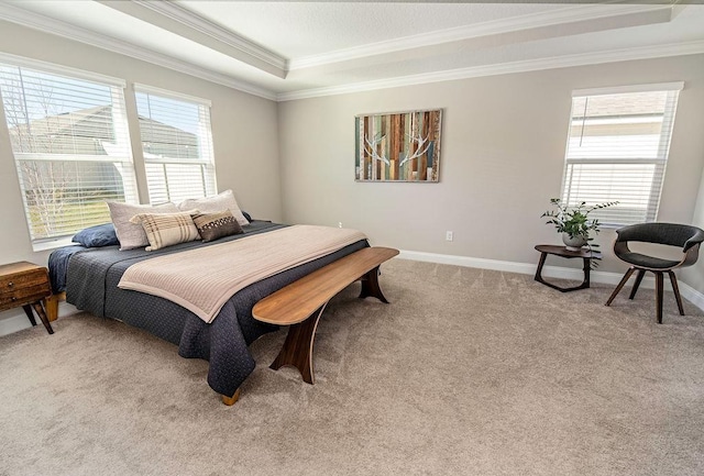 bedroom with a raised ceiling, light carpet, and crown molding