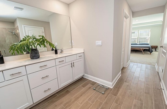 bathroom with vanity and a shower with shower door