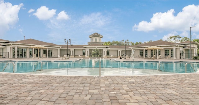 view of swimming pool with a patio