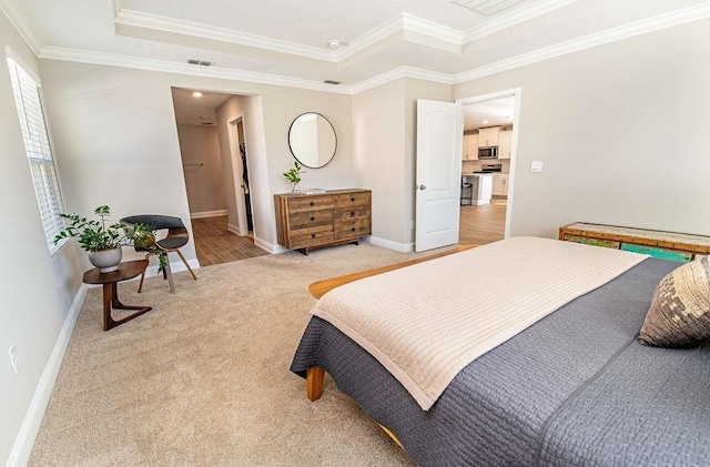 bedroom featuring a raised ceiling, crown molding, and light colored carpet