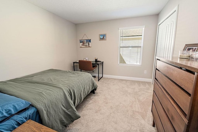 carpeted bedroom featuring a closet