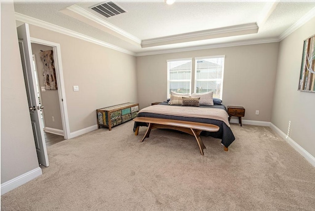 bedroom featuring light colored carpet, a raised ceiling, and crown molding