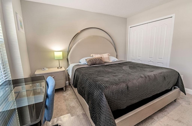 carpeted bedroom featuring a closet