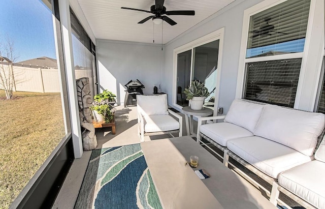 sunroom with ceiling fan