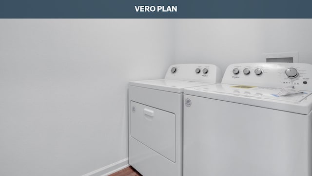 clothes washing area featuring separate washer and dryer