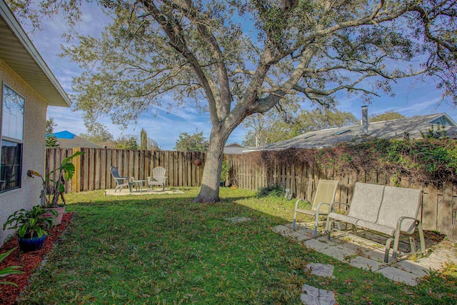 view of yard featuring a fenced backyard and a patio