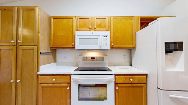 kitchen featuring light countertops, white appliances, and brown cabinets