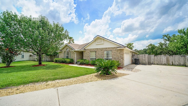 ranch-style house featuring a garage and a front yard