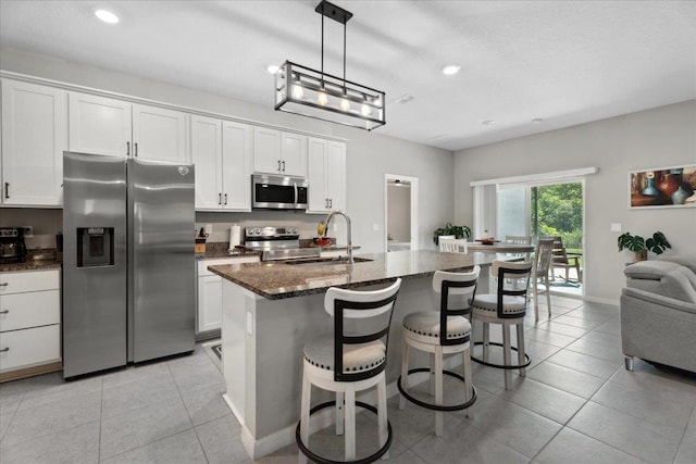 626 Ocean Jasper Dr, Saint Augustine, FL 32086 - kitchen with appliances with stainless steel finishes, light tile patterned flooring, white cabinets, and recessed lighting